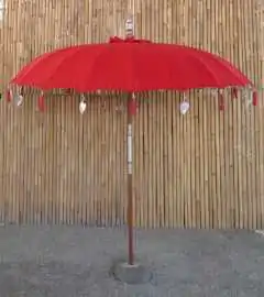 Bali umbrella, chinese red with metal coins and silver hearts hanging around the edge, ø 230 cm and 250cm height 